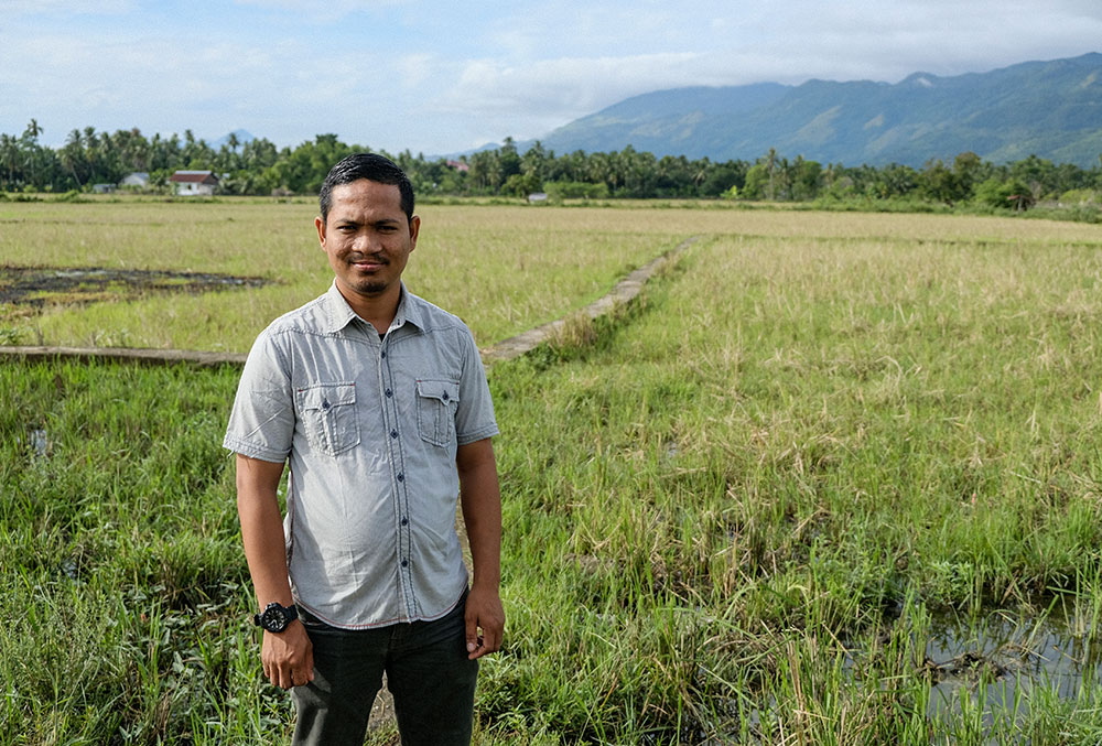 Rahmad standing in a field