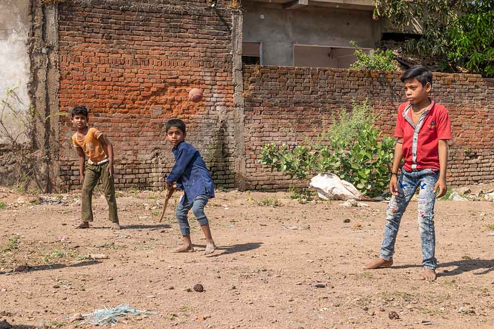 Sahil ready to swing cricket bat with ball in the air