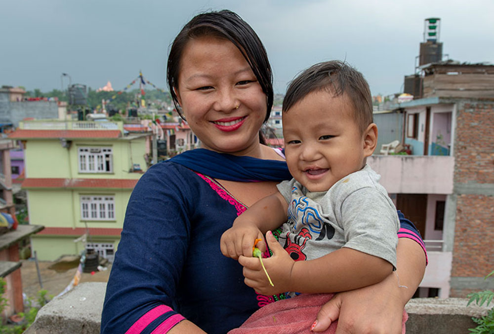 Smile and his mother smile together after his free Smile Train cleft surgery in Nepal