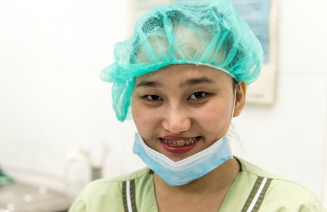 Gracee in mask and scrubs