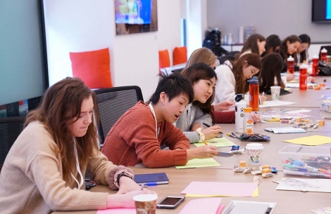 Group of student making cards at Smile Train office