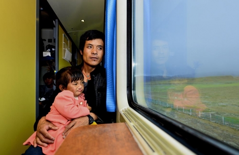 Renpuci on a train with her dad