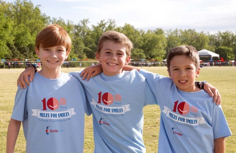 Three students with Smile Train shirts