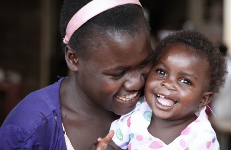 A mother with her child after her cleft lip and palate surgery