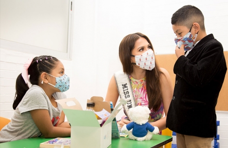 Miss Universe Andrea Meza with two Smile Train patients in Mexico