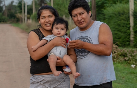 Miguel's parents hold him after his cleft surgery