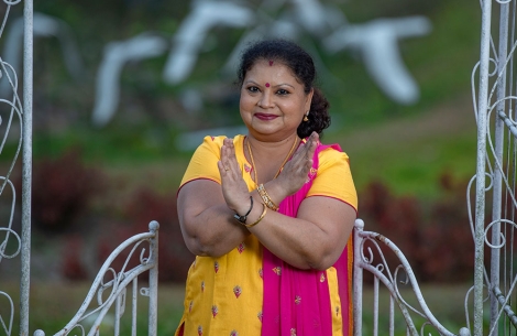 Dr. Neela making the #BreakTheBias hand symbol for International Women's Day