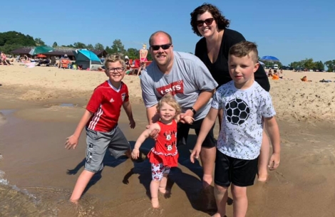 Monica Bush with her family at the beach