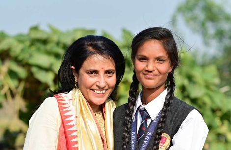 Mamta Carroll smiling and hugging Pinki