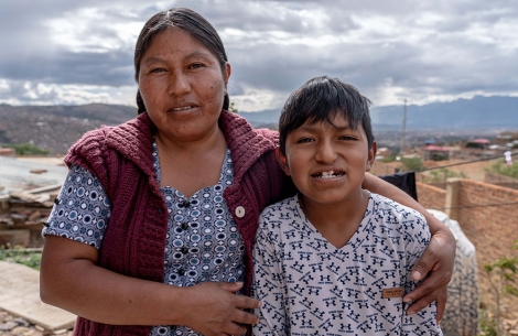 Luis smiling with his mother Elsa