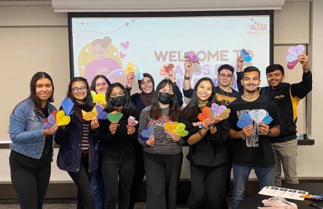 Members of Project Dental All posing with their origami heart cards