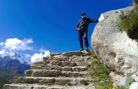 Sunil at the top of a stone staircase on the ascent to Everest Base Camp