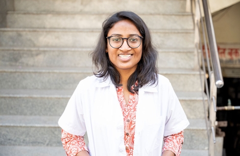 Dr. Mayuri Kalyanpad smiling in a lab coat after cleft surgery