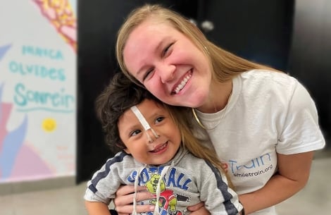 Sara Horne hugging Smile Train patient
