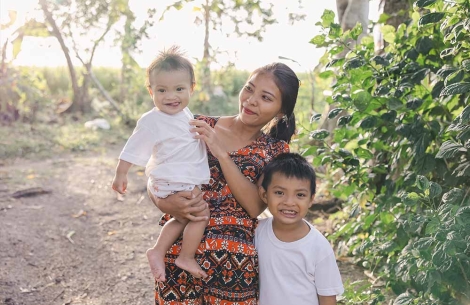 Desiree smiles with her two sons Jefferson and Jeffrey