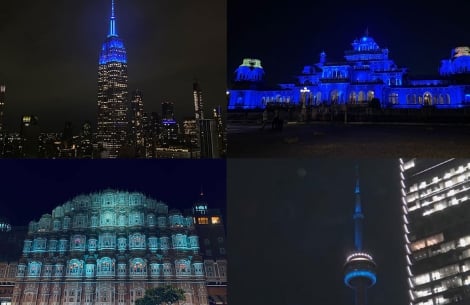 The Empire State Building, Hawa Mahal, Royal Albert Hall, and CN Tower lit up in blue at night for World Smile Day