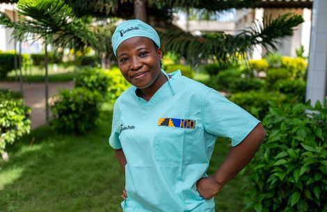 Dr. Sanni looking to the camera in Smile Train scrubs