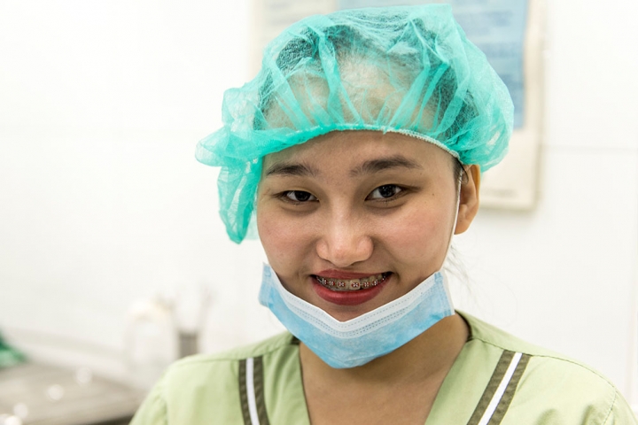 Gracee in mask and scrubs