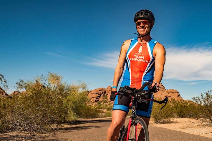 Man with Team EMPOWER jersey in the desert