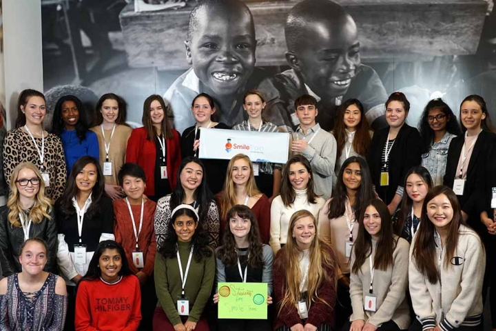 student ambassadors posing in Smile Train headquarters