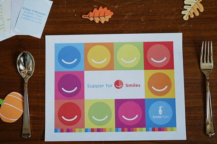 Supper for Smiles placemat with fork and spoon
