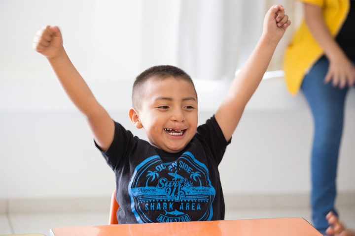 boy with hands in the air