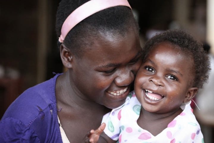 A mother with her child after her cleft lip and palate surgery