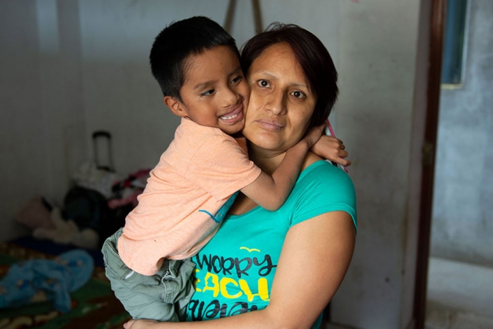 Anghelo hugs his mother after free cleft surgery in Peru