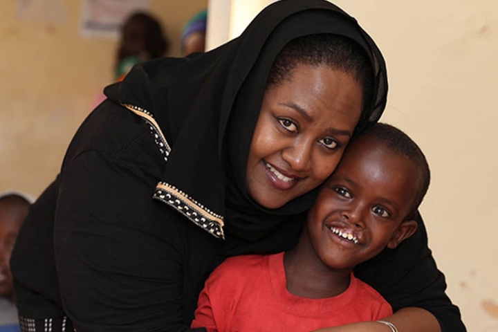 Sesnie hugging a boy after cleft lip and cleft palate surgery in Ethiopia