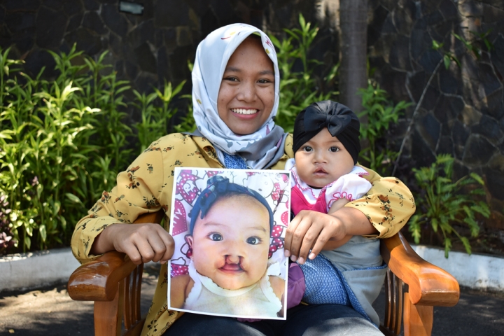 woman holding baby