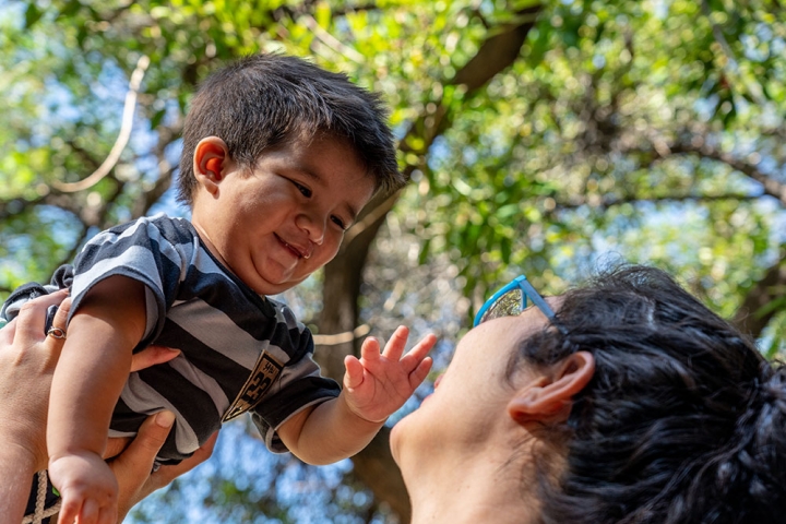 Felix's mother holds him after his free Smile Train-sponsored cleft surgery in Argentina
