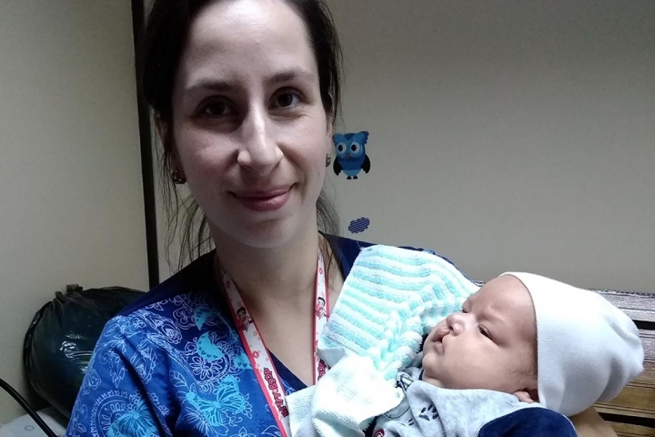 nurse lisette with a baby