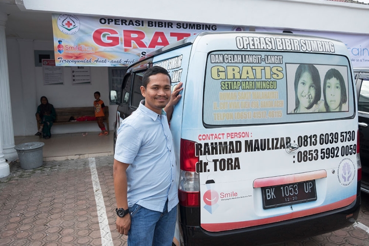 Rahmad stands by his Smile Train recruitment van