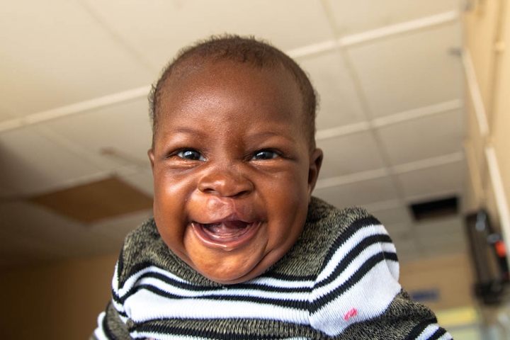 Boy laughs at camera