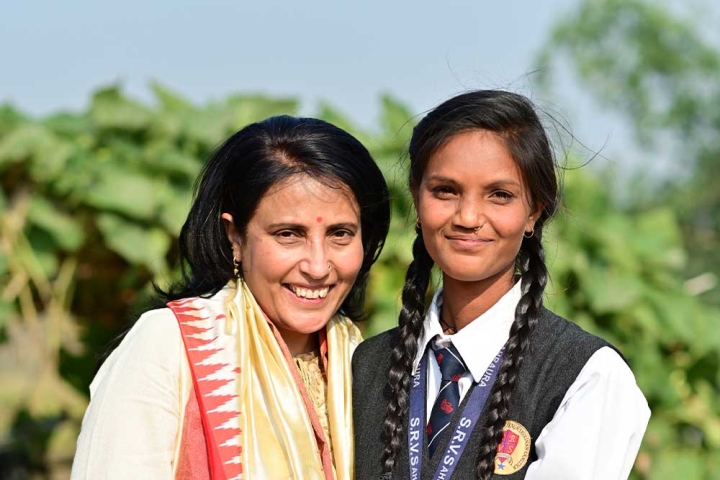 Mamta Carrol smiling and hugging Pinki