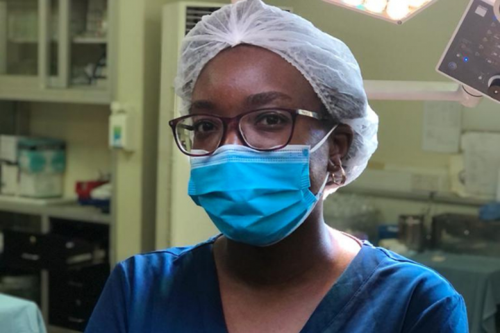 Dr. Liz Igaga in scrubs and mask