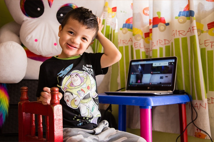 Alex smiling at his computer