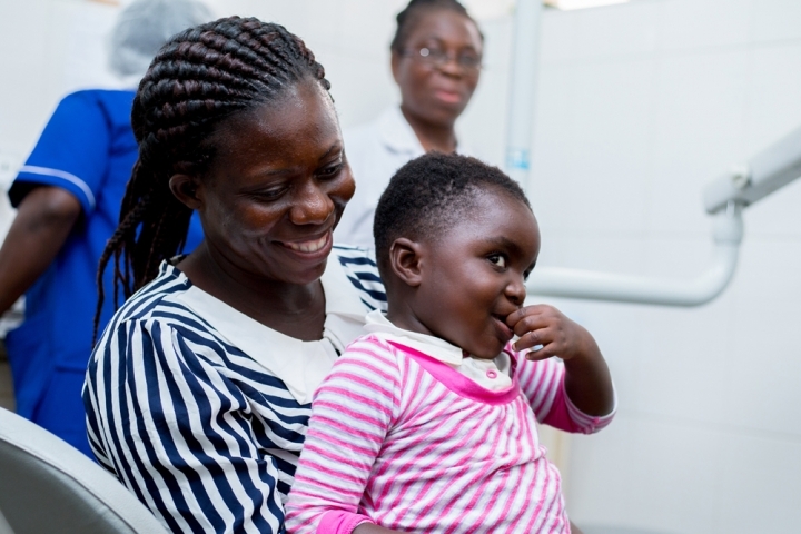 Smile Train patient and their mother smiling at KATH