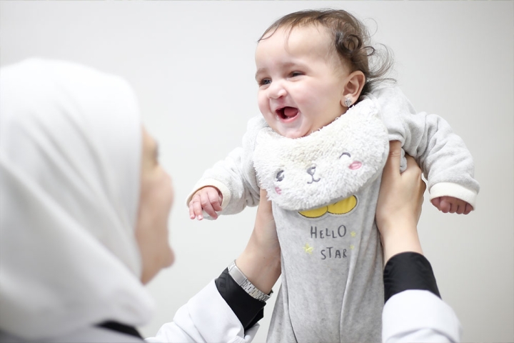 Misk being held in the air