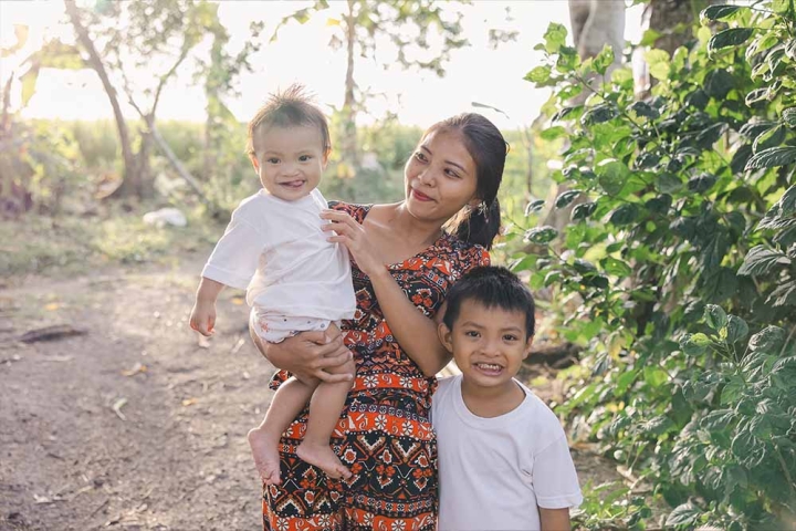 Desiree smiles with her two sons Jefferson and Jeffrey