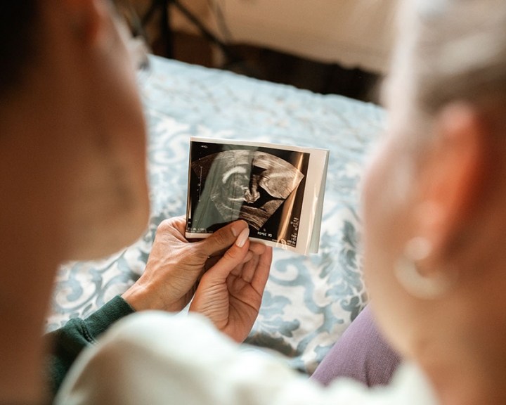 couple looking at ultrasound image