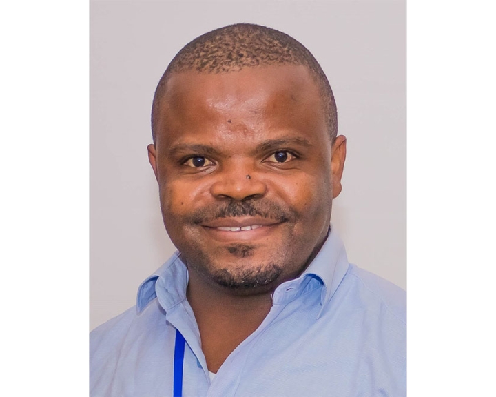 Dr. Masumbuko Mukamba Franck smiling headshot