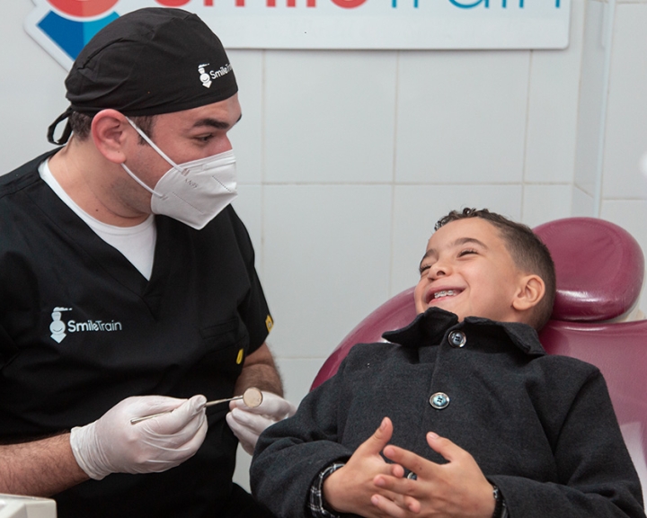 Smile Train partner dentist with Smile Train patient