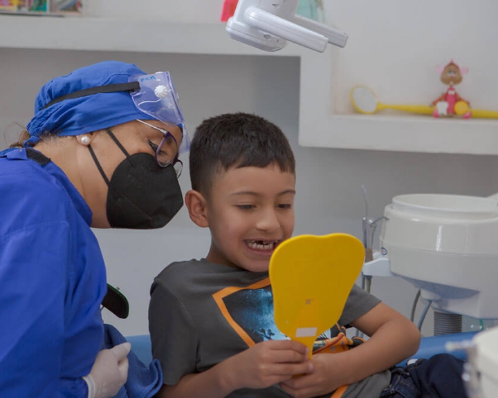 Dentist checking childs teeth