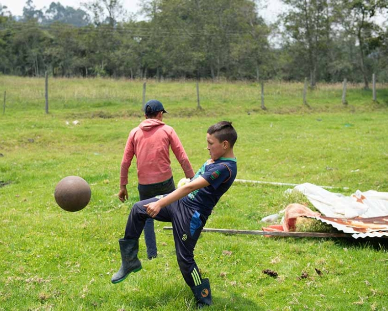 Neitan playing soccer with his brother