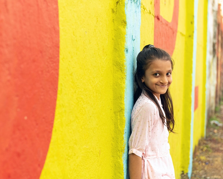 Humera leaning against the wall