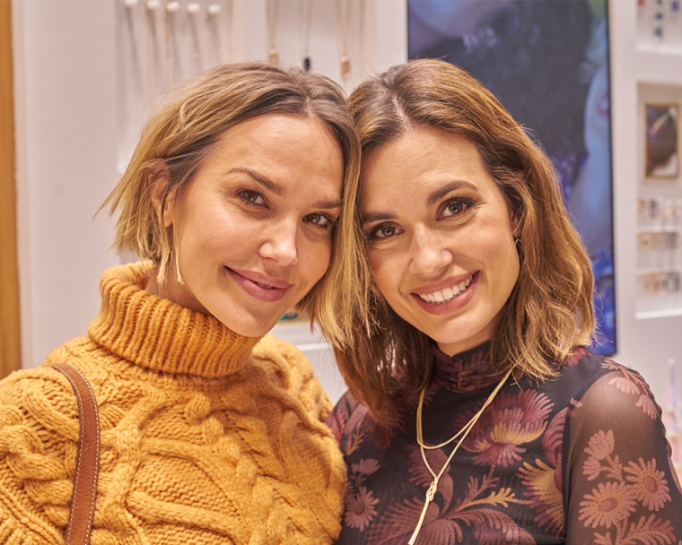 Arielle Kebbel and Torrey DeVitto smiling at the Kendra Scott Giving Tuesday event