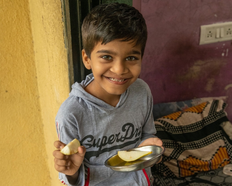 Samrat smiling and eating lunch