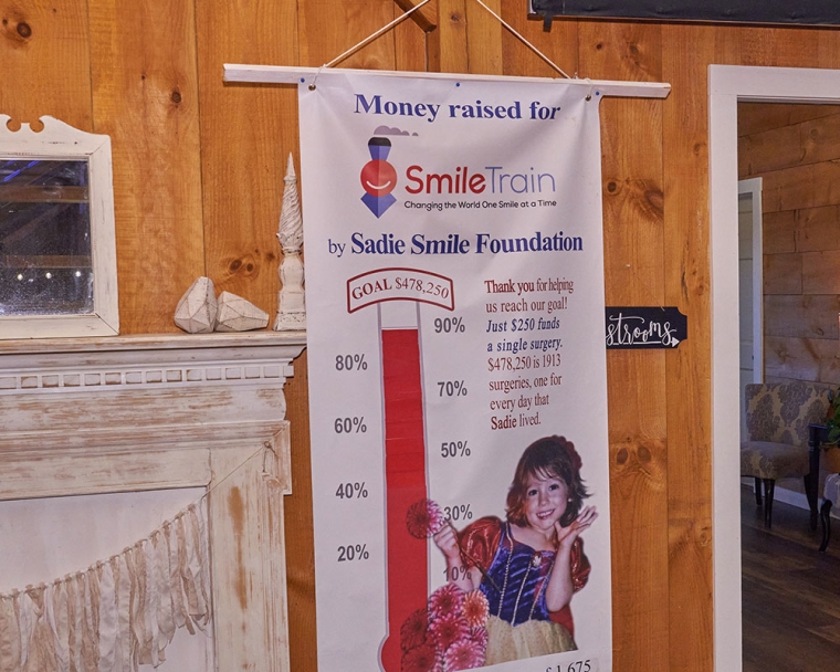 Smile Train thermometer fundraising banner at Sadie's Gala