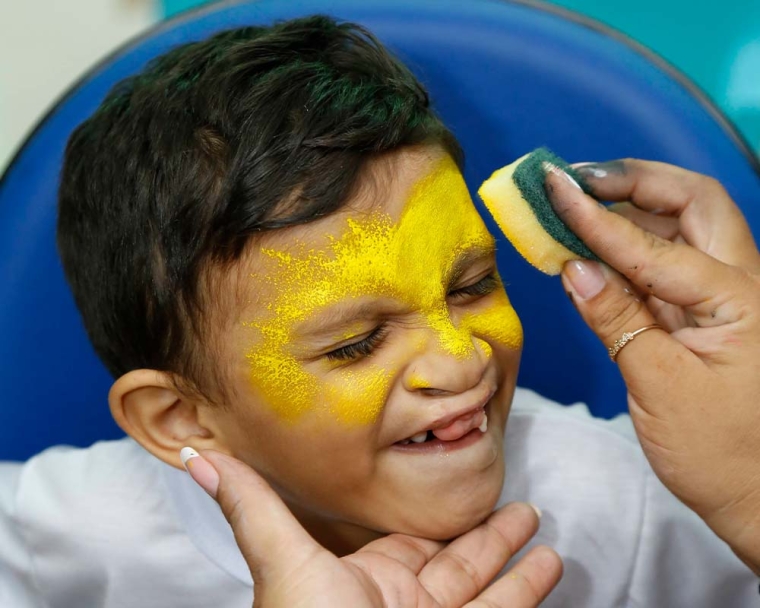 Child gets his face painted